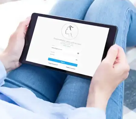 patient holding tablet on lap making spa appointment